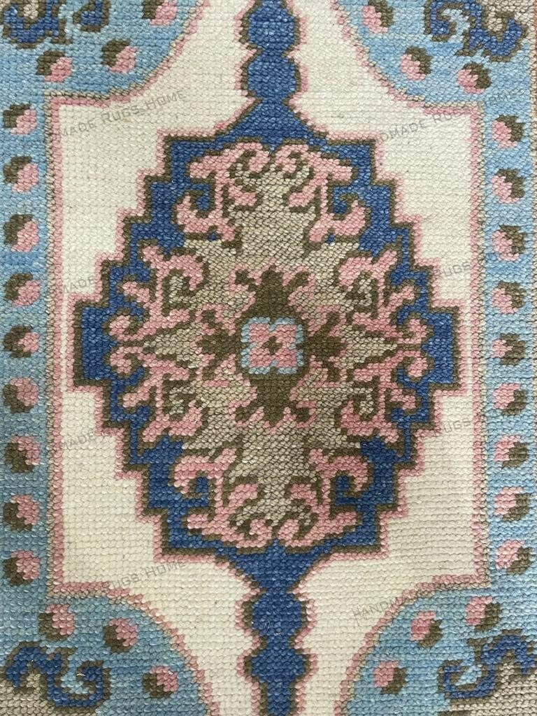 Luxurious Oushak rug featuring traditional floral motifs and muted colors.