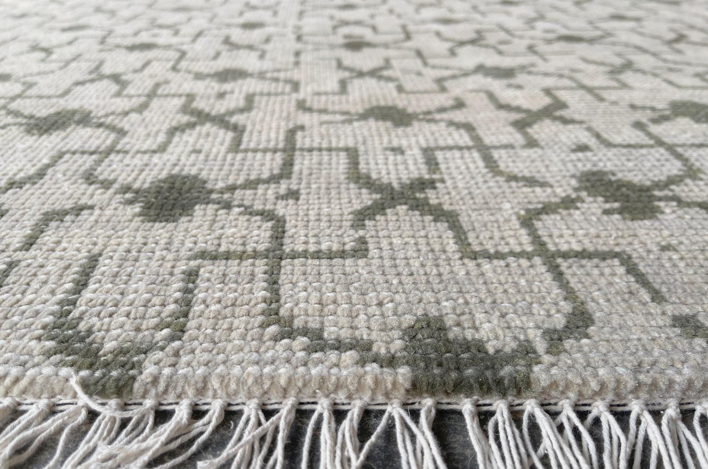 Subtle gray and cream Oushak rug for a minimalist yet classic style.