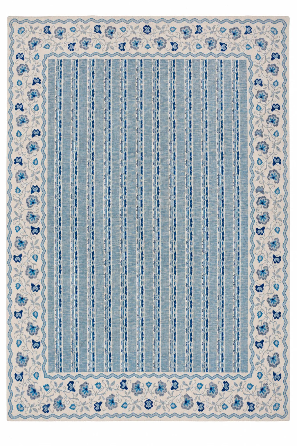 Full view of blue and ivory Modern Oushak rug with repeating vertical pattern and decorative floral border