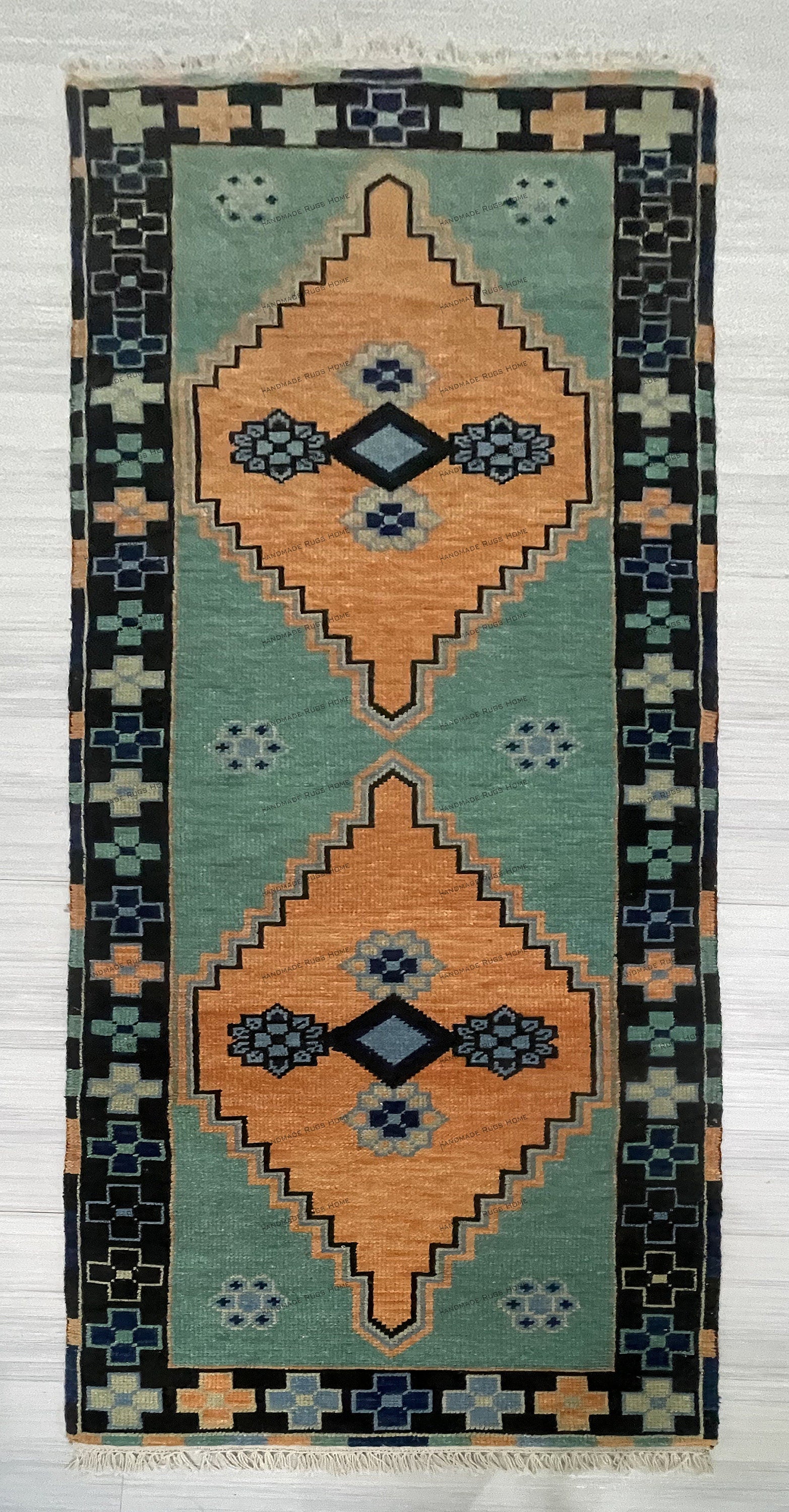 Beautiful floral green area rug with intricate multicolor accents.