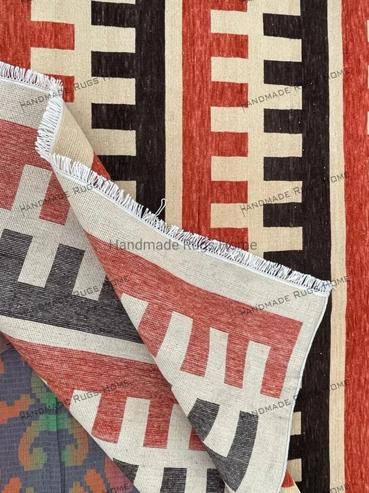 Modern striped rug with intricate block designs in earthy tones.