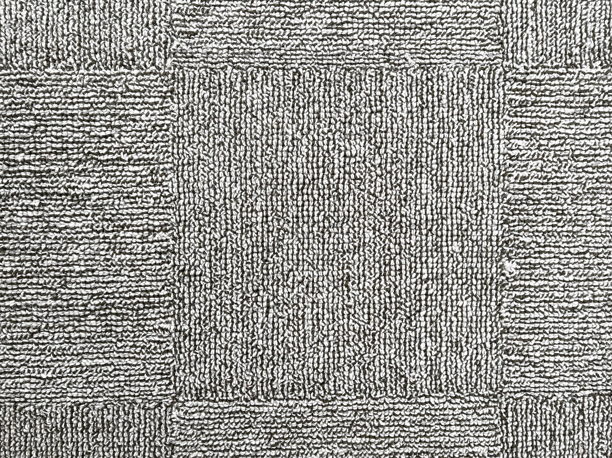 Unique modern rug with hand-tufted patterns in warm and cool tones.