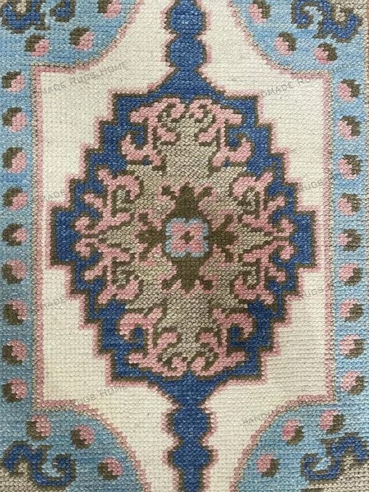 Luxurious Oushak rug featuring traditional floral motifs and muted colors.