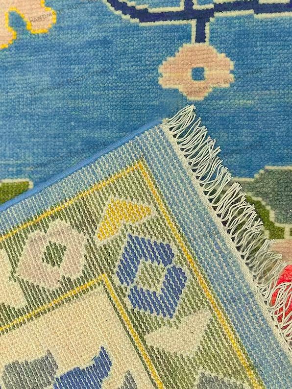Artful and eclectic wool rug with bold colors suitable for modern and contemporary homes.