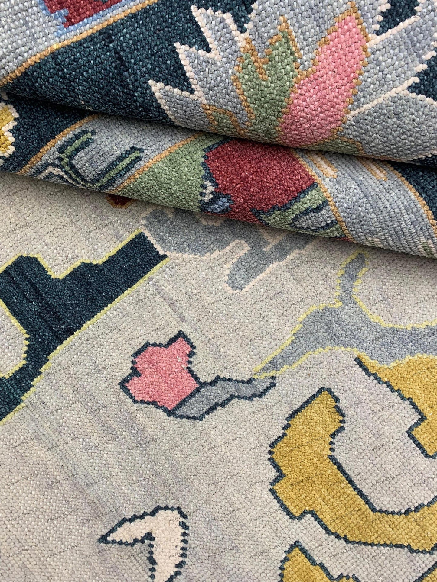 Intricate geometric and floral motifs are woven throughout, showcasing traditional Oushak craftsmanship.