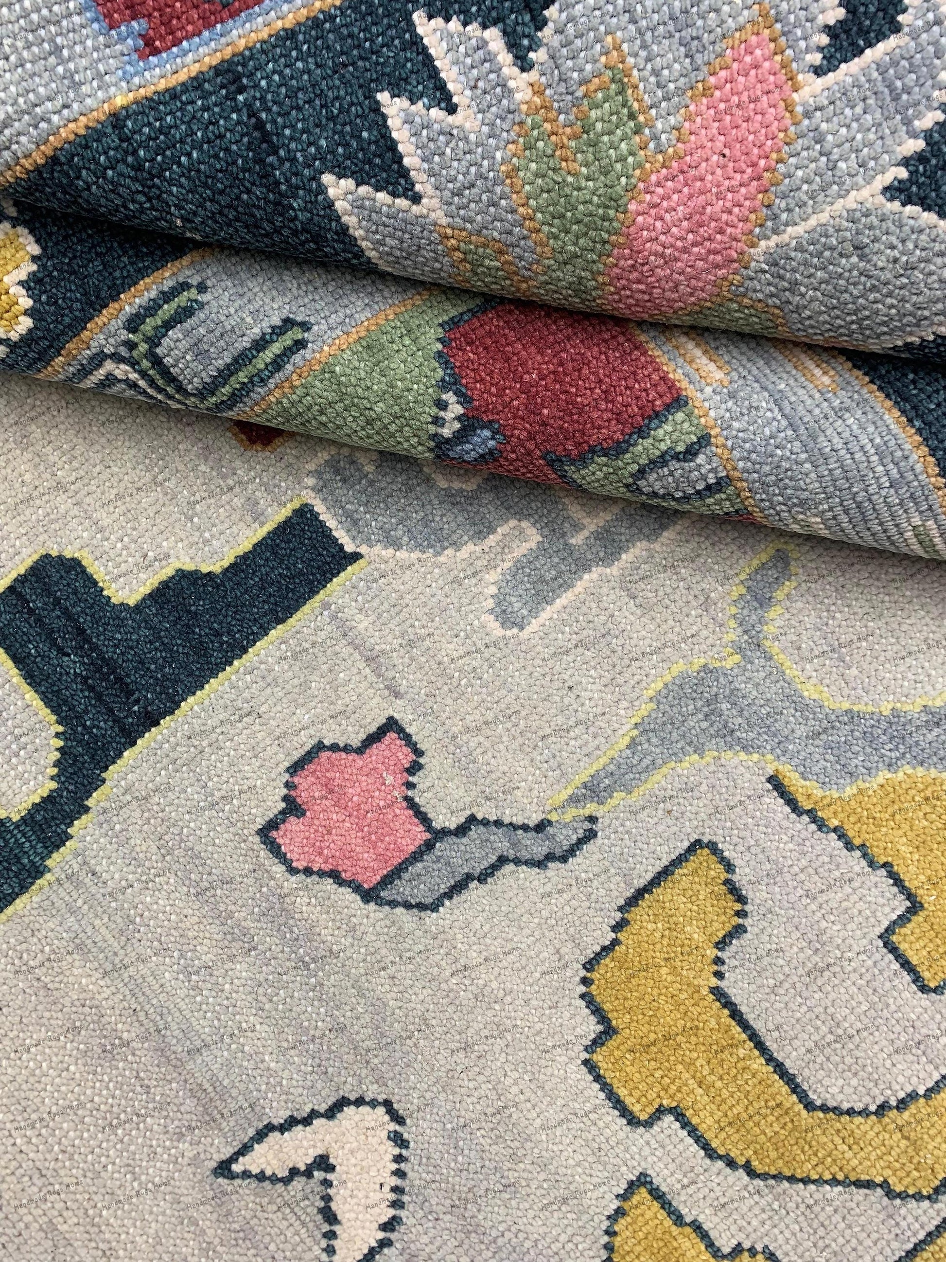 Intricate geometric and floral motifs are woven throughout, showcasing traditional Oushak craftsmanship.
