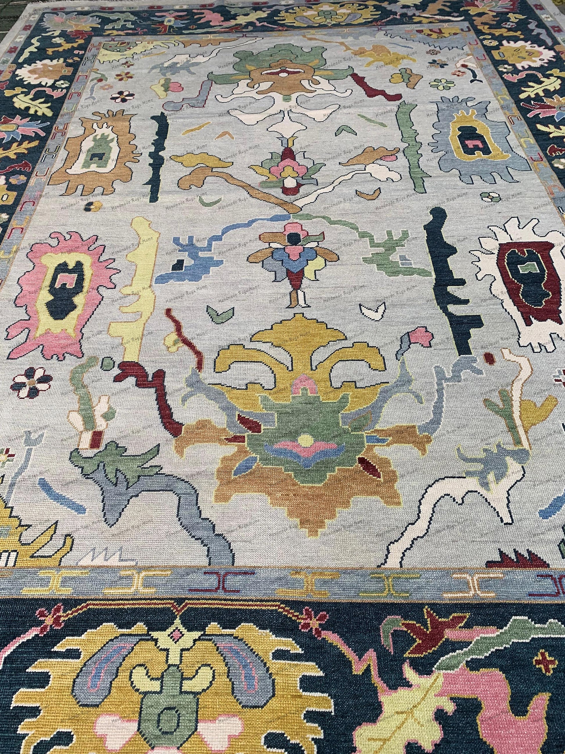 Tasteful accents, like a simple vase or artwork, complement the rug & classic design.