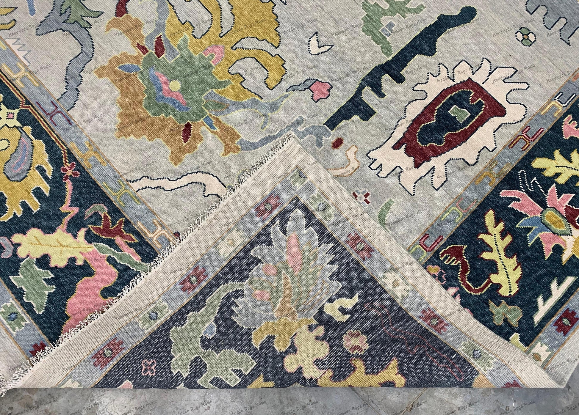 The luxurious wool texture is highlighted, revealing the plush pile and fine detailing.