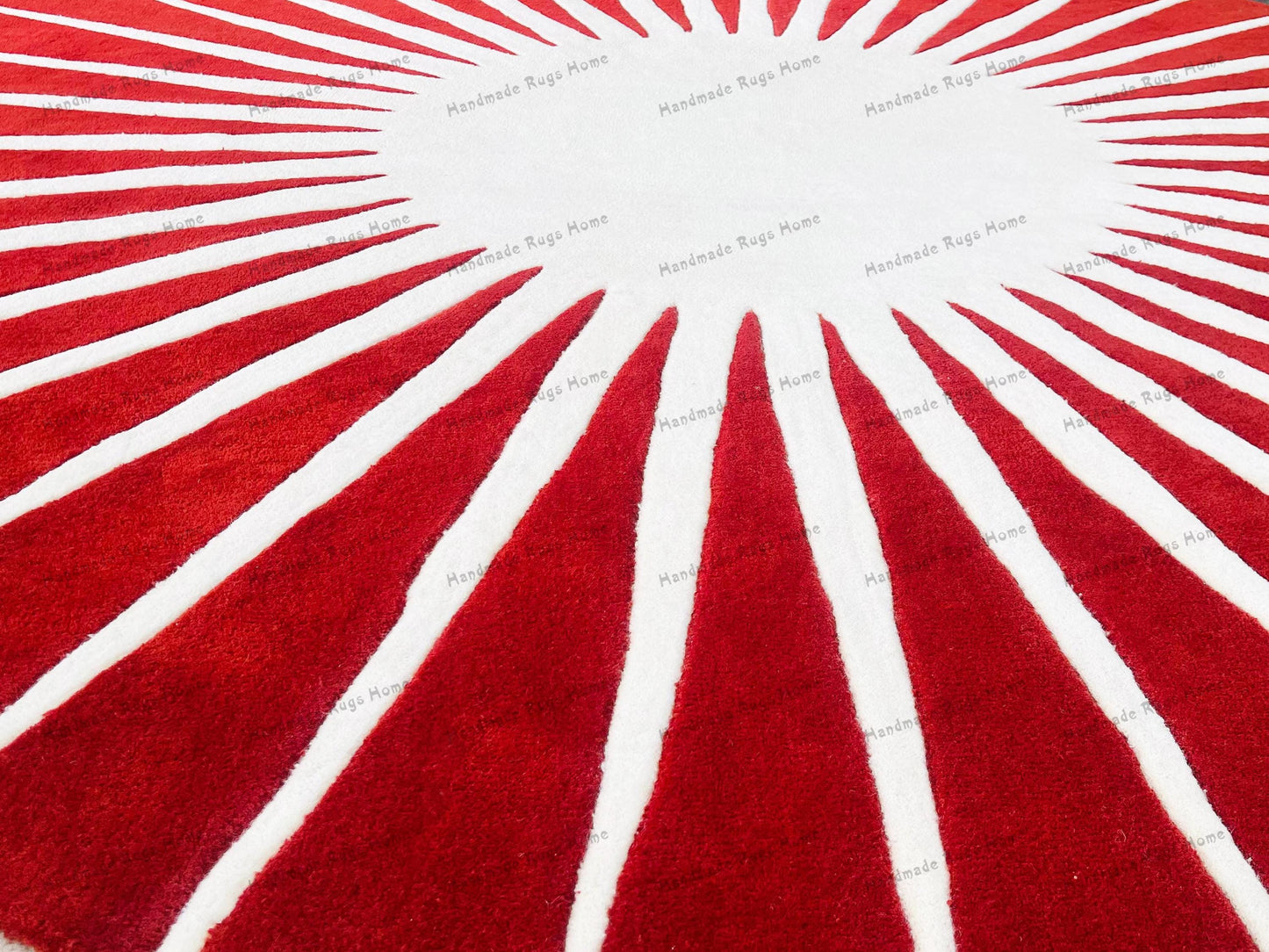 Handmade round rug featuring red stripes
