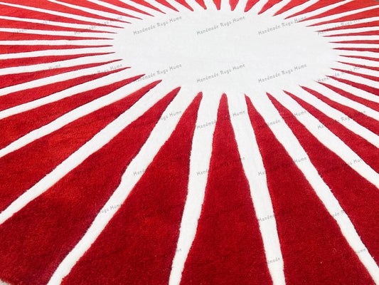 Handmade round rug featuring red stripes