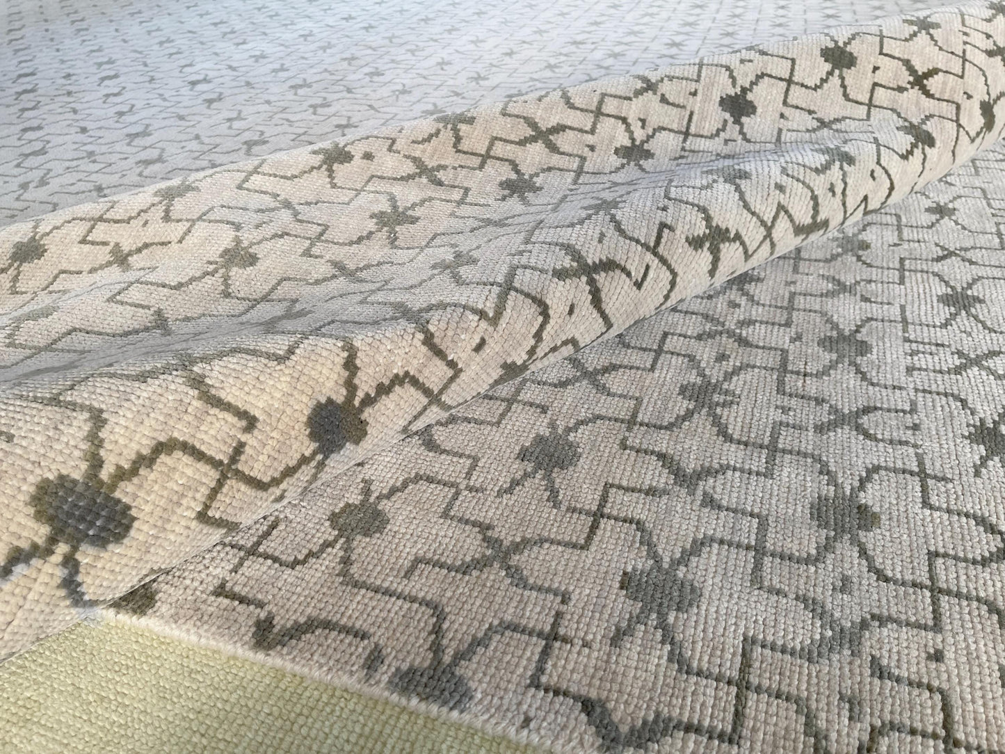 Authentic Oushak area rug with timeless patterns in neutral colors.