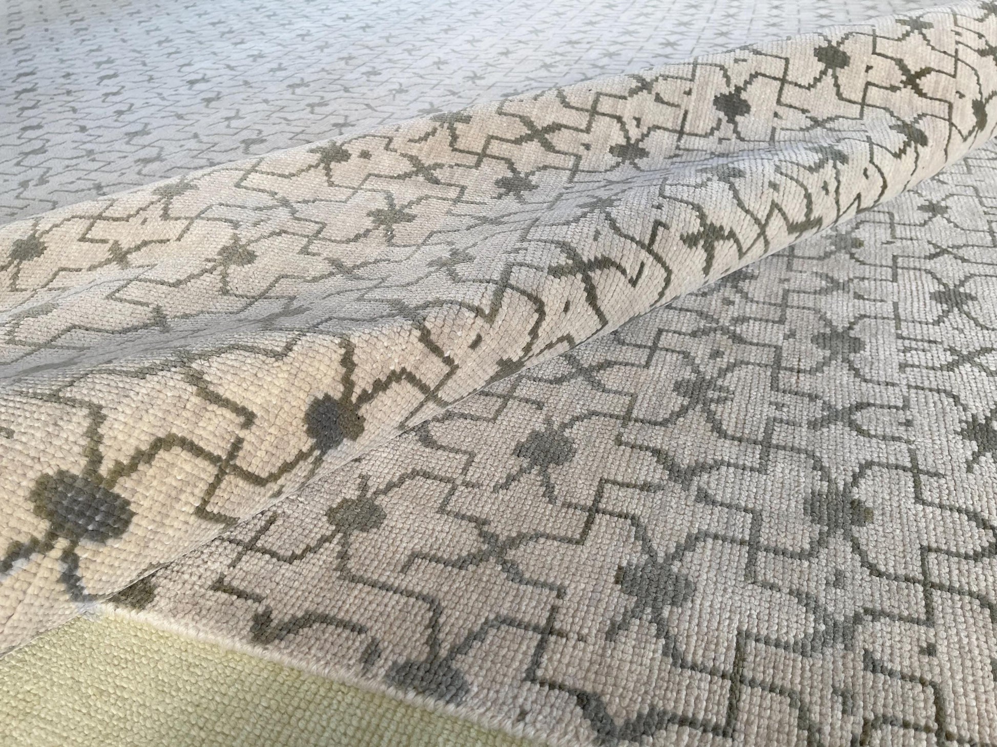 Authentic Oushak area rug with timeless patterns in neutral colors.