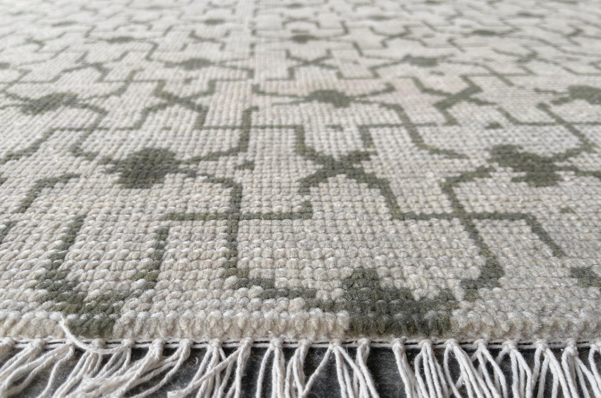 Subtle gray and cream Oushak rug for a minimalist yet classic style.
