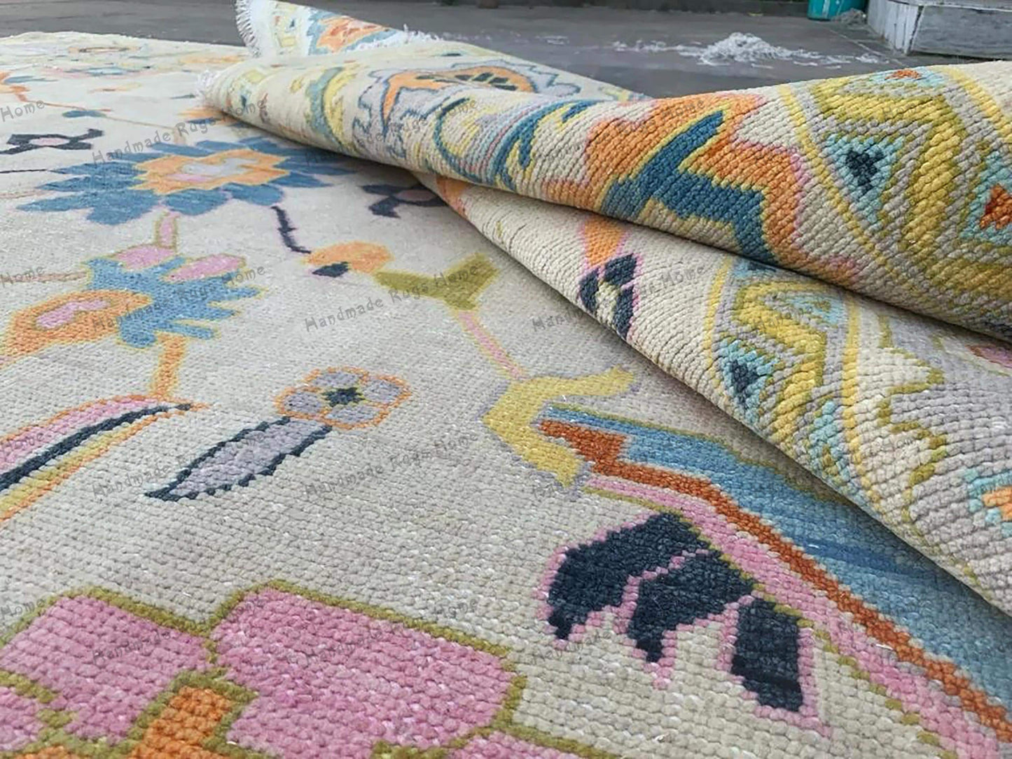 Traditional Turkish Oushak rug in soft pastel colors