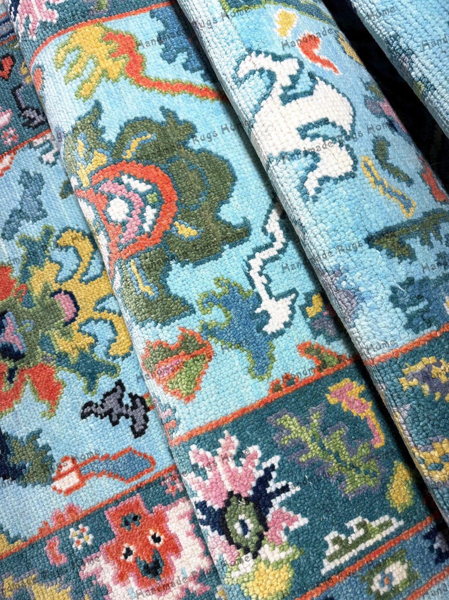 A vibrant handwoven blue Oushak rug with intricate floral patterns and traditional Turkish design, perfect for adding elegance and warmth to any living space.