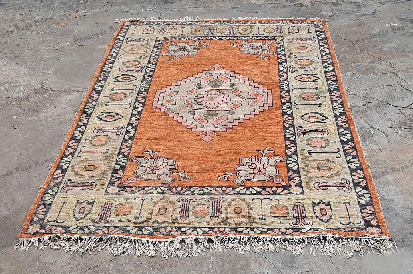 Handmade Persian-style carpet with a classic border