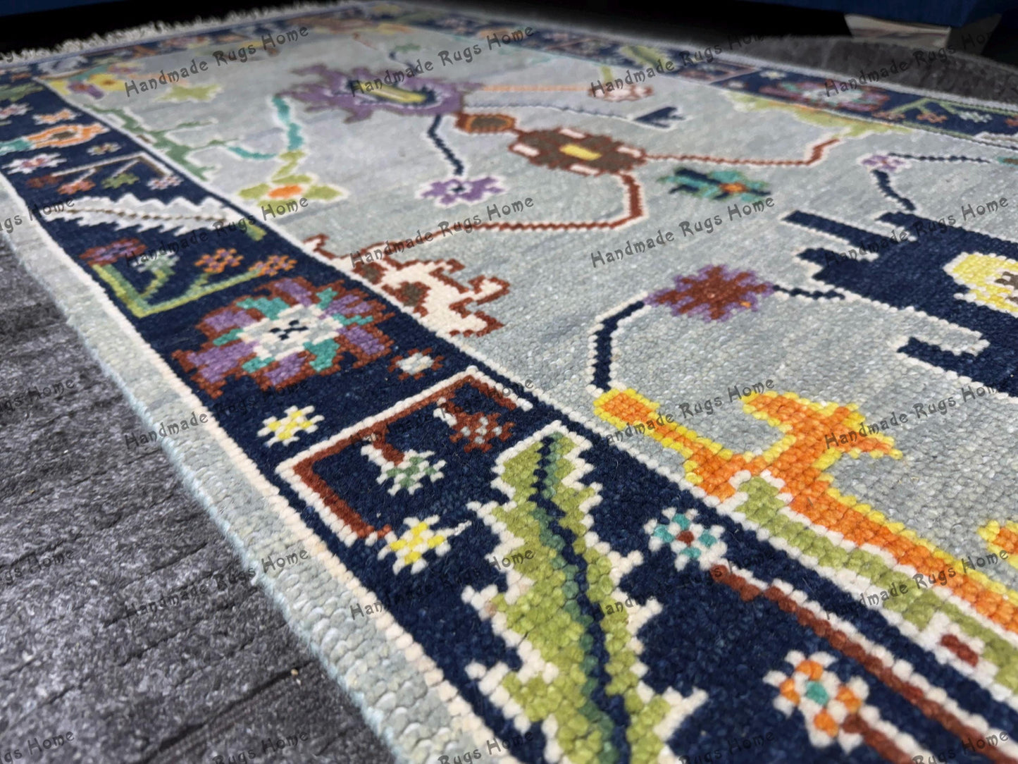 Colorful floral Turkish Oushak rug with soft wool texture.