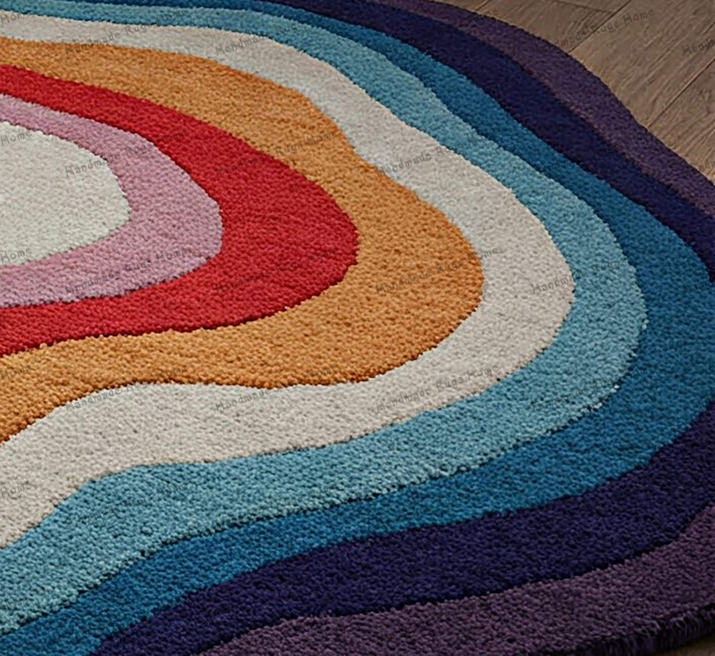 Handmade tufted rug with intricate patterns in vibrant colors, placed on a wooden floor.