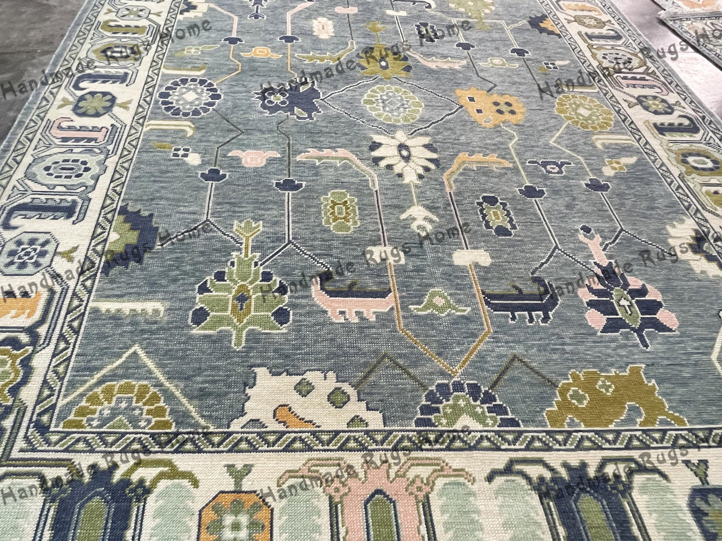 Handmade woolen rug with antique Turkish patterns.