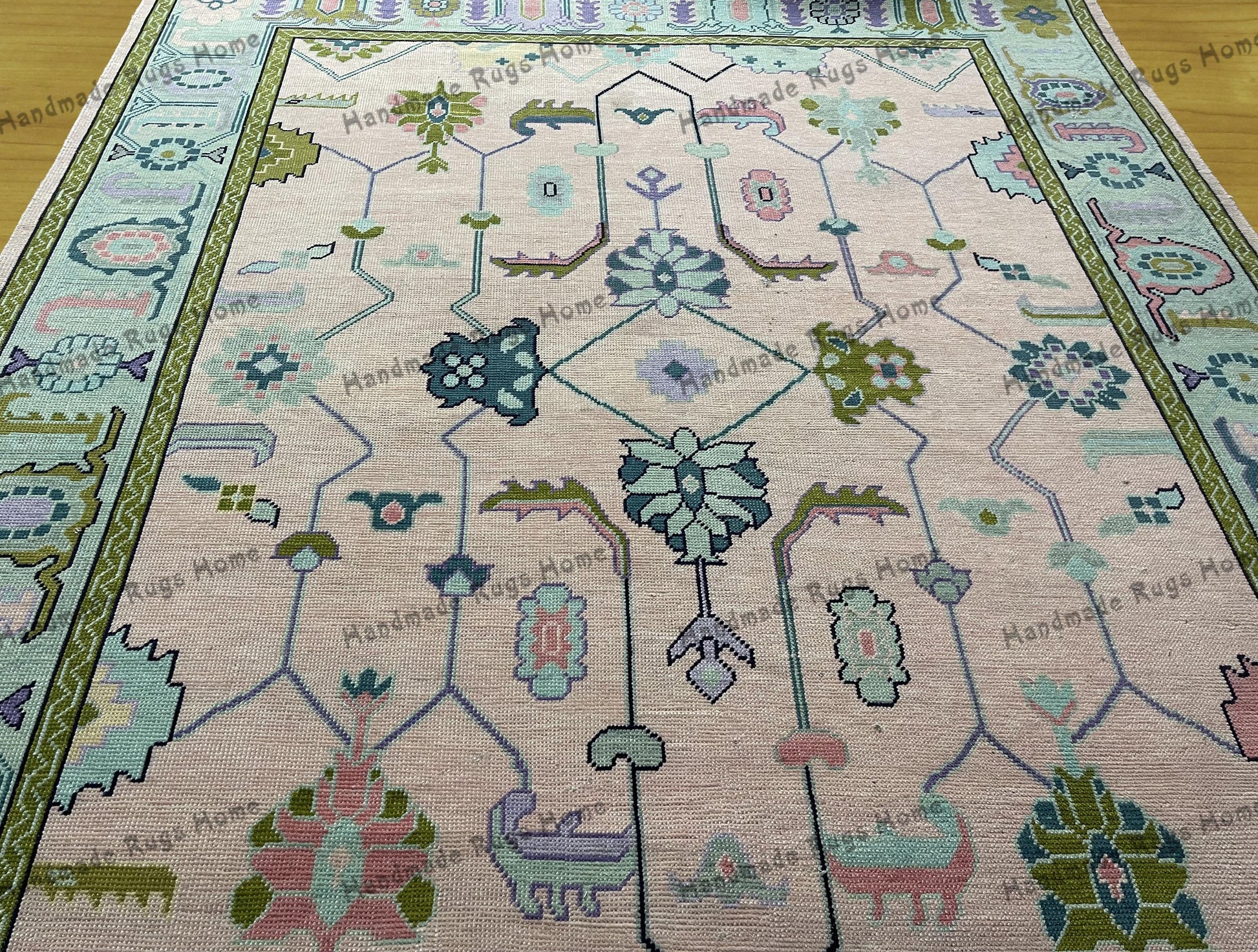 Modern Turkish carpet featuring Oushak-style patterns and soft colors.