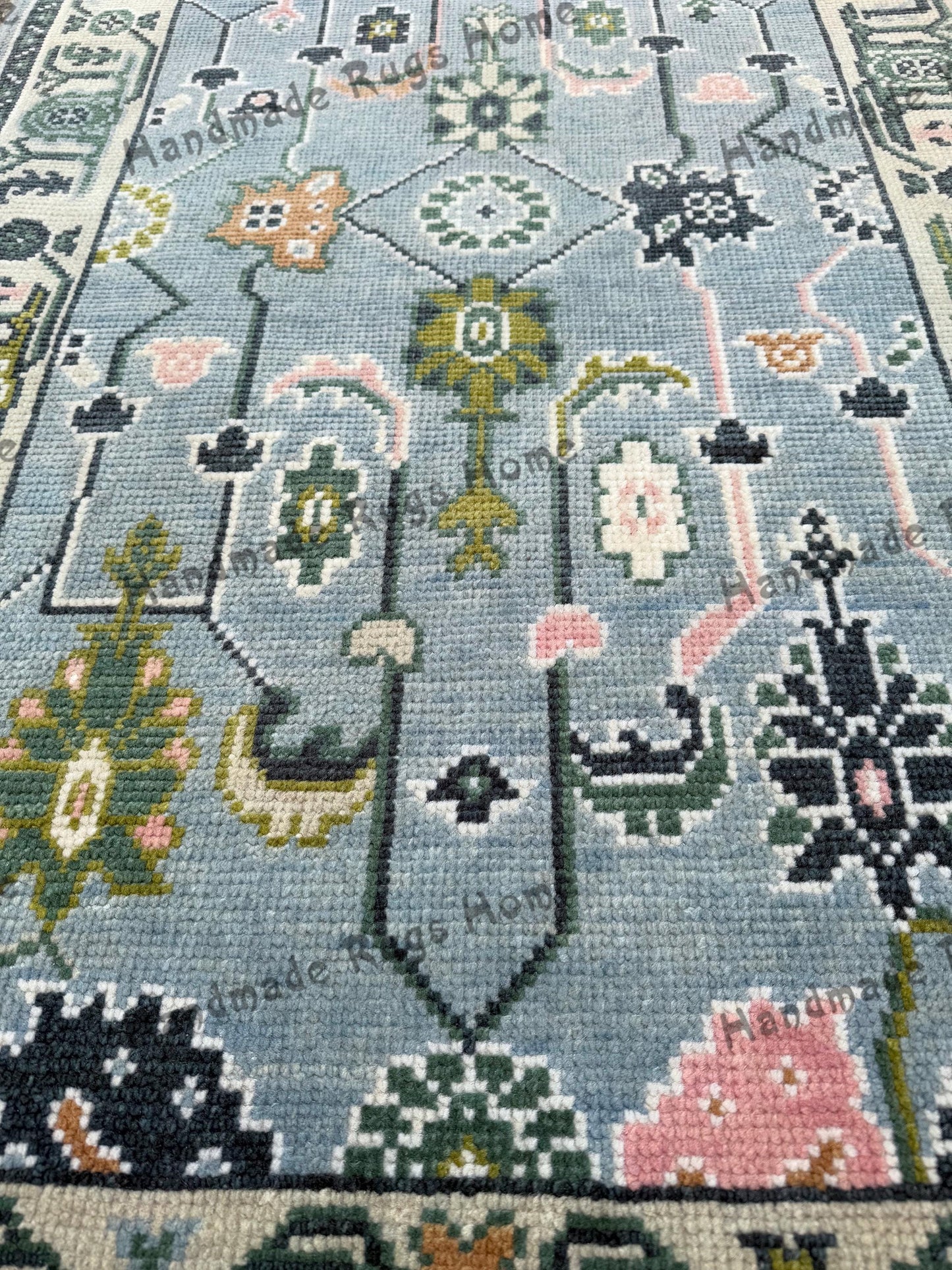Vibrant handmade Oushak rug, featuring traditional Turkish patterns, ideal for gifting or home décor.