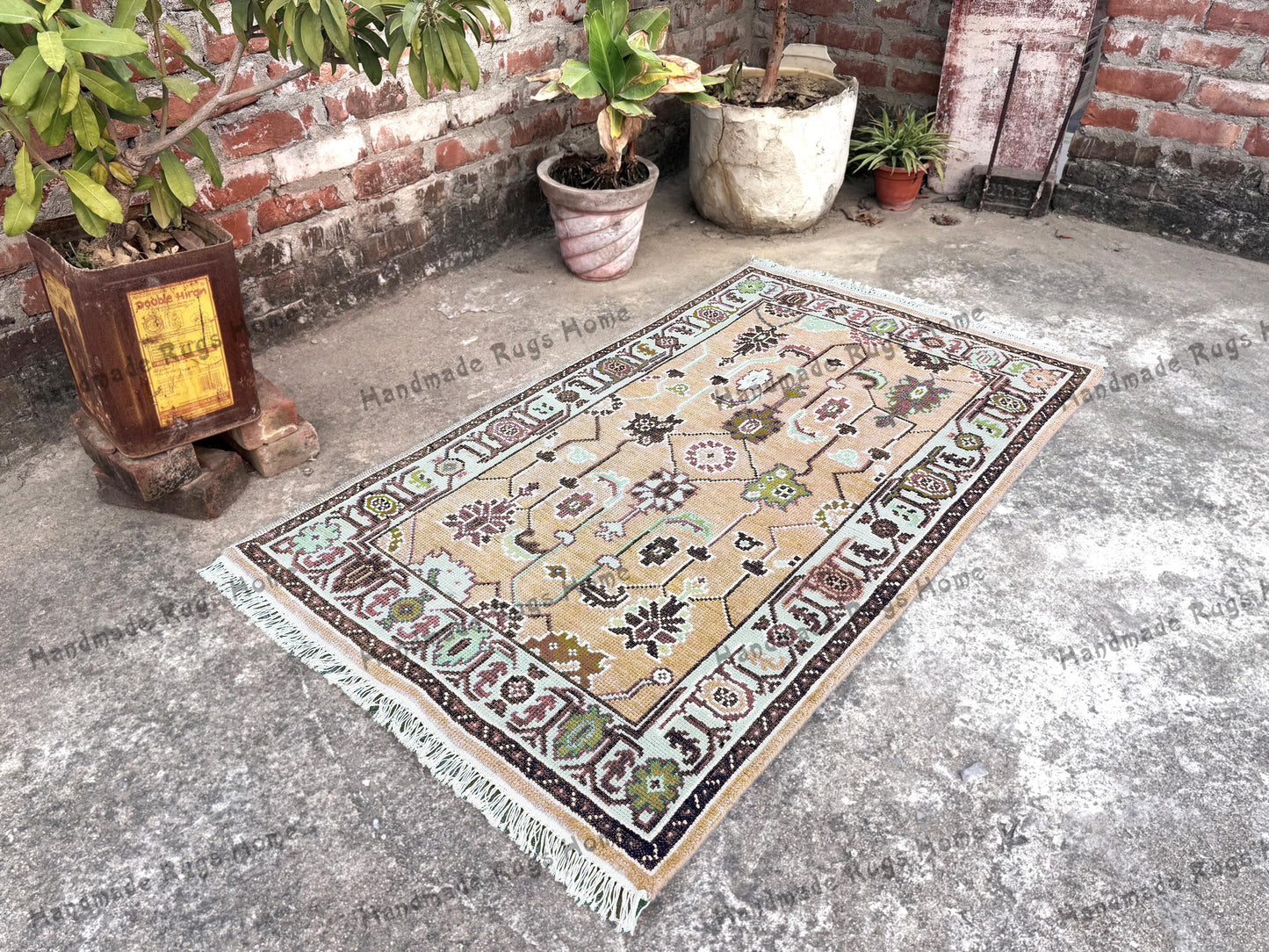 Oushak area rug with floral medallion designs in teal and pastel shades.