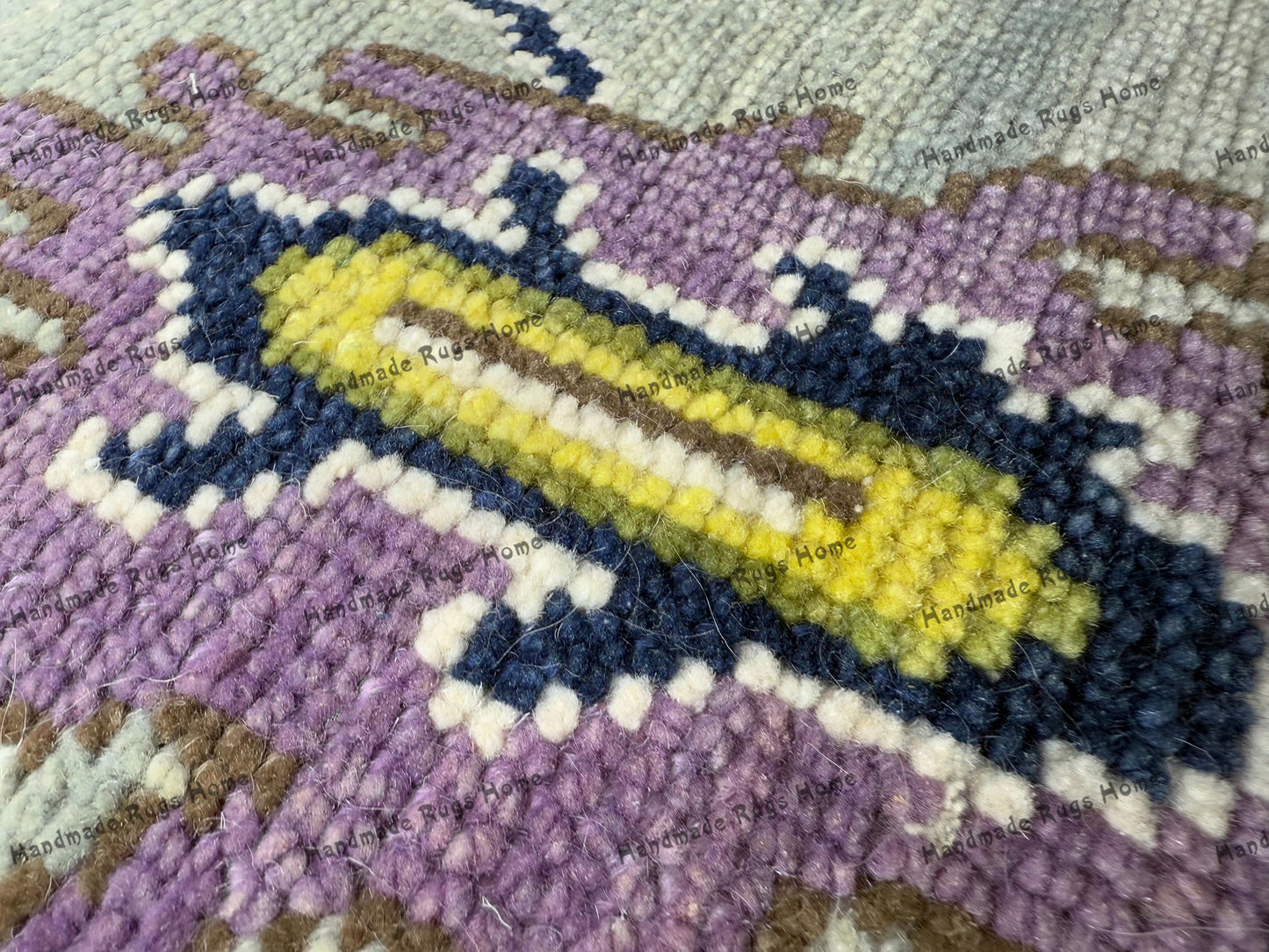 Artisan-crafted Oushak rug in vibrant hues for boho-chic interiors.