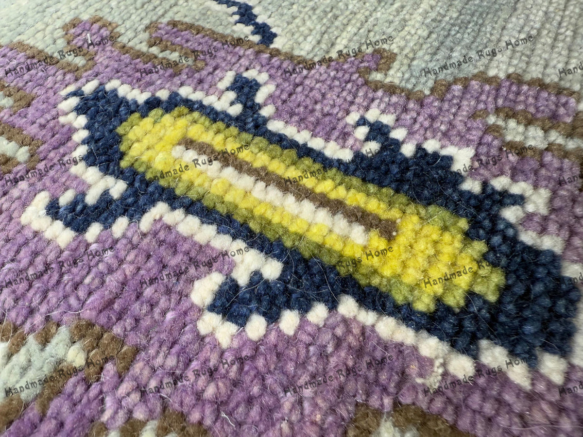 Artisan-crafted Oushak rug in vibrant hues for boho-chic interiors.