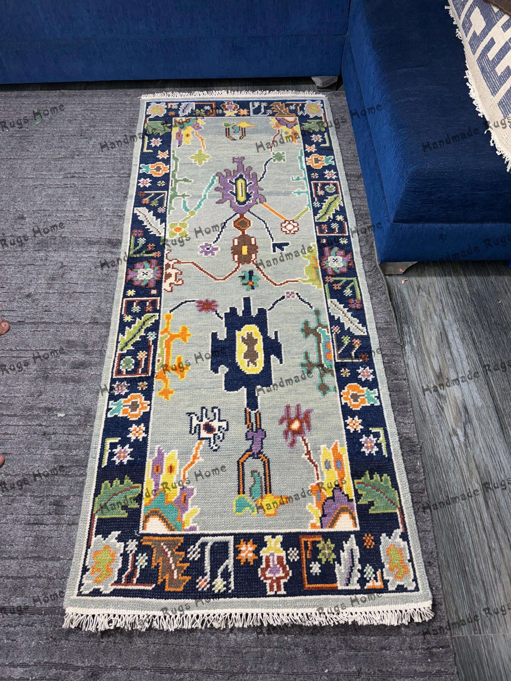Hand-knotted Turkish Oushak runner rug with vibrant floral designs.