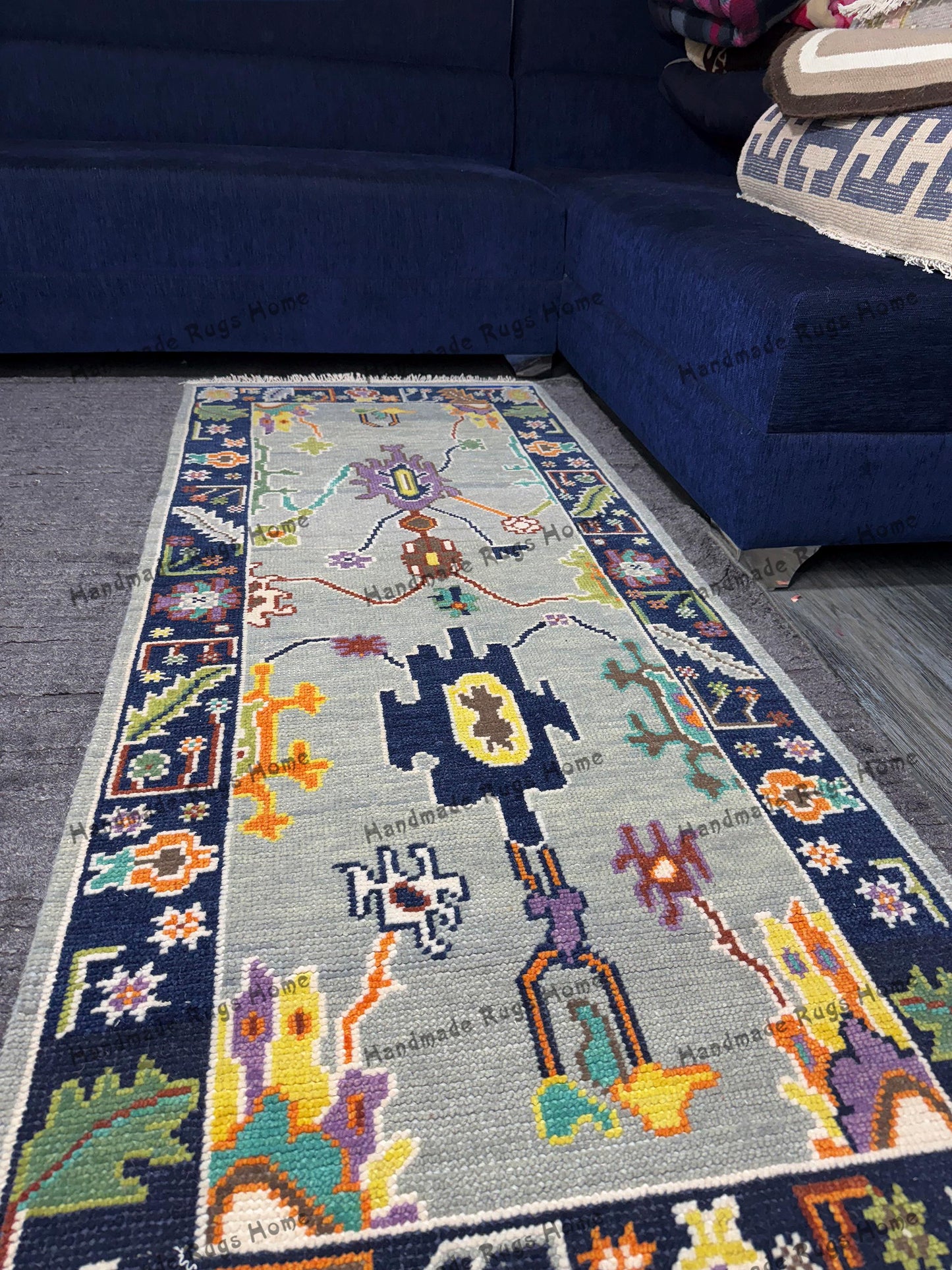 Vintage-inspired Oushak rug featuring intricate patterns and bold colors.