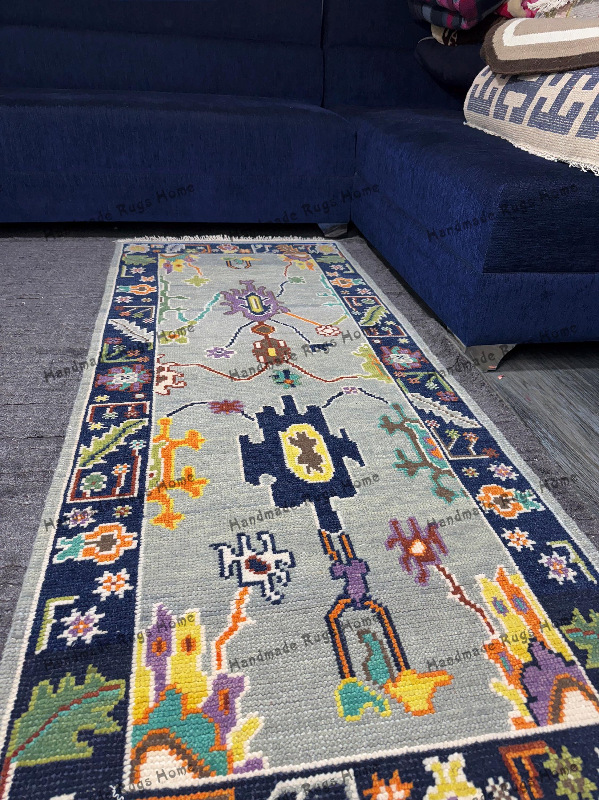 Vintage-inspired Oushak rug featuring intricate patterns and bold colors.