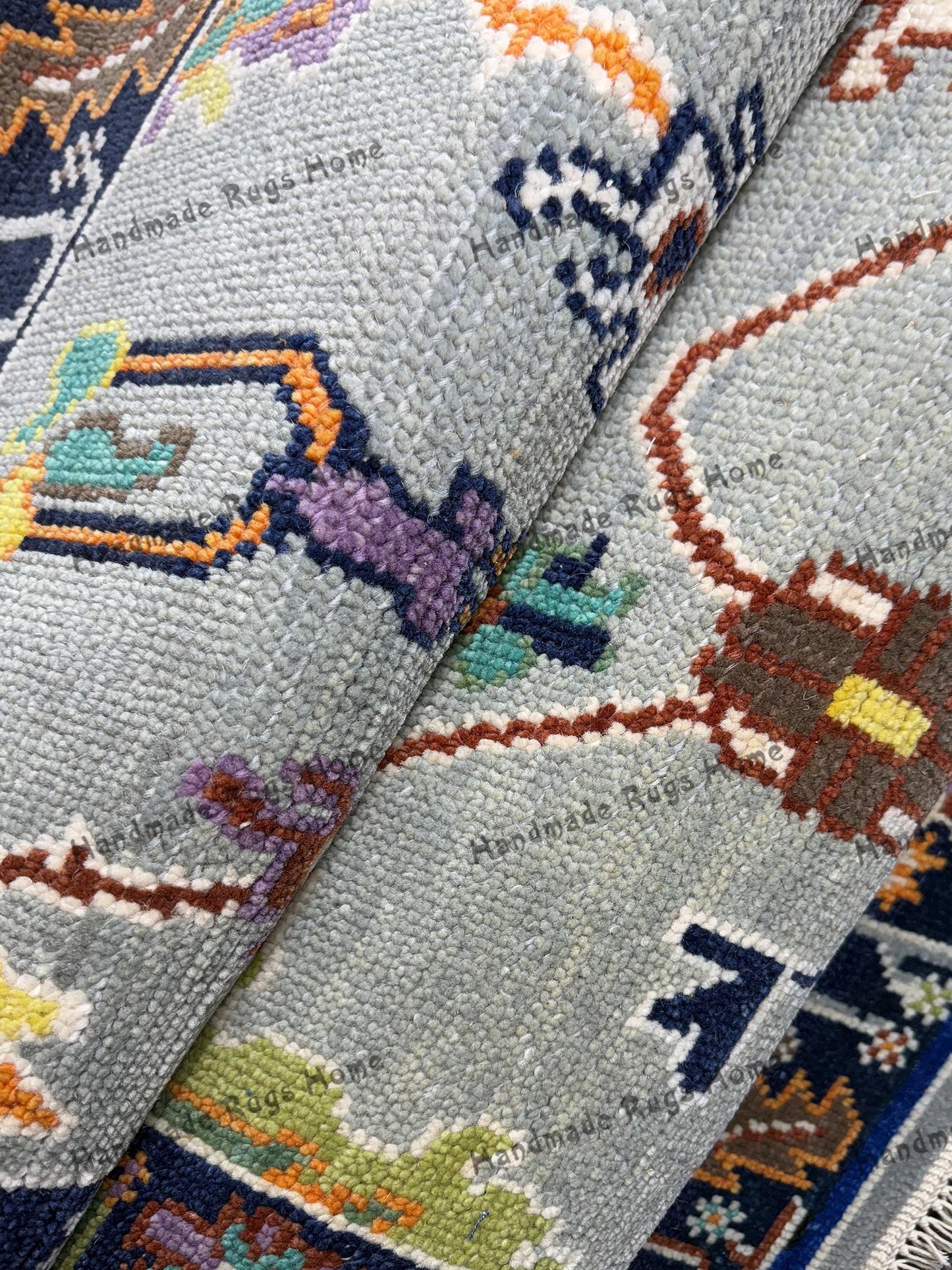 Beautiful hand-knotted Oushak carpet with timeless floral patterns.