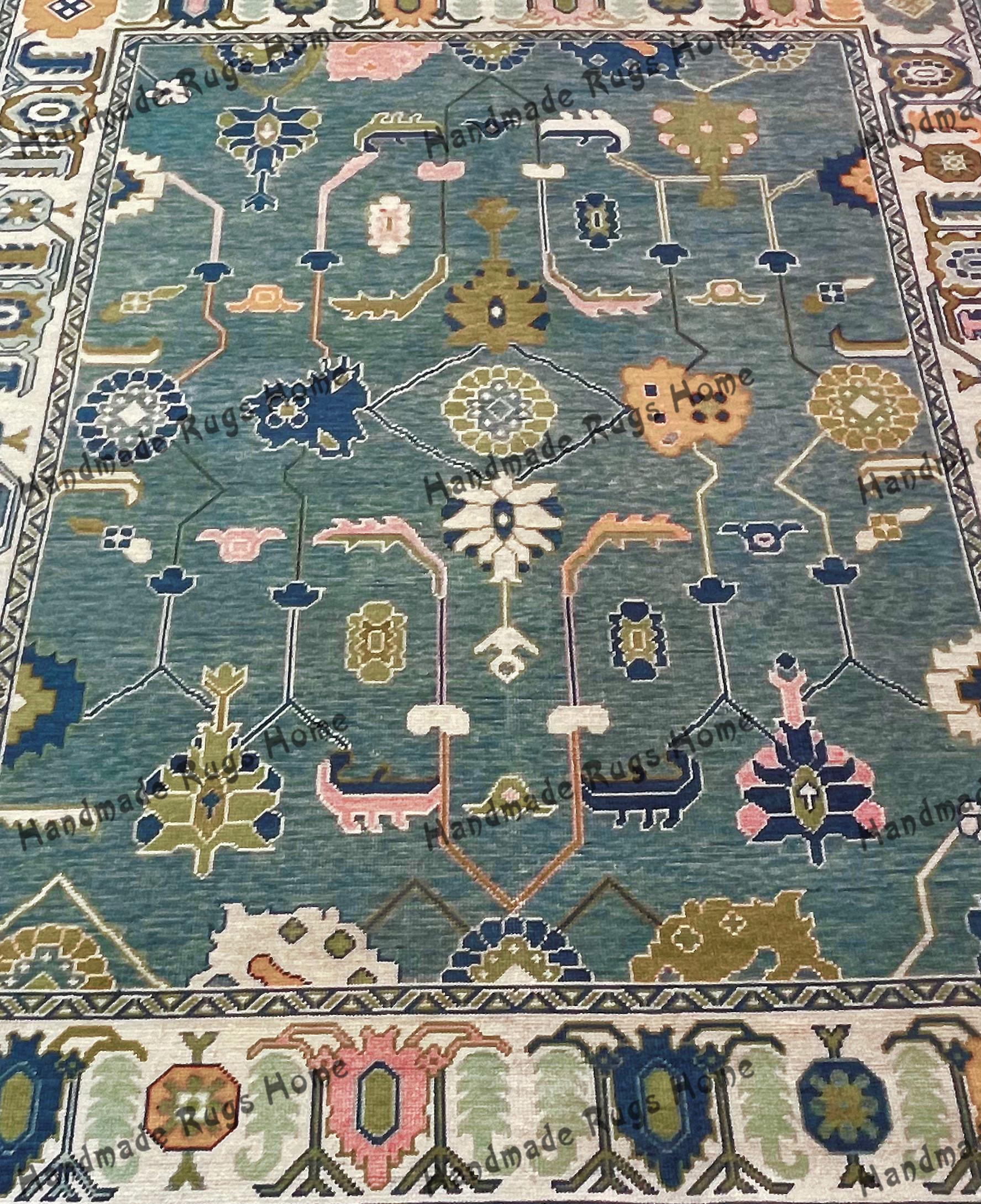 Handwoven blue Oushak rug with intricate floral patterns.