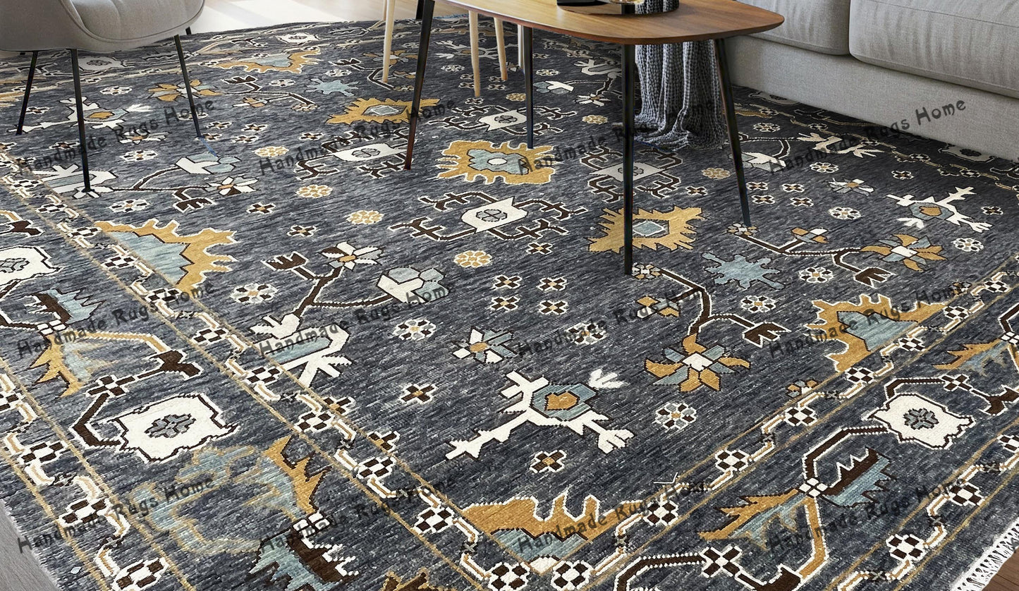 Hand-knotted Oushak rug with intricate gray and gold patterns.