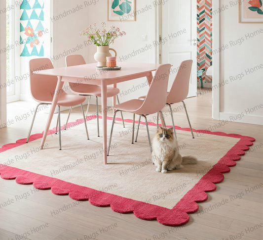 Ivory and aqua scalloped edge wool rug in dining room