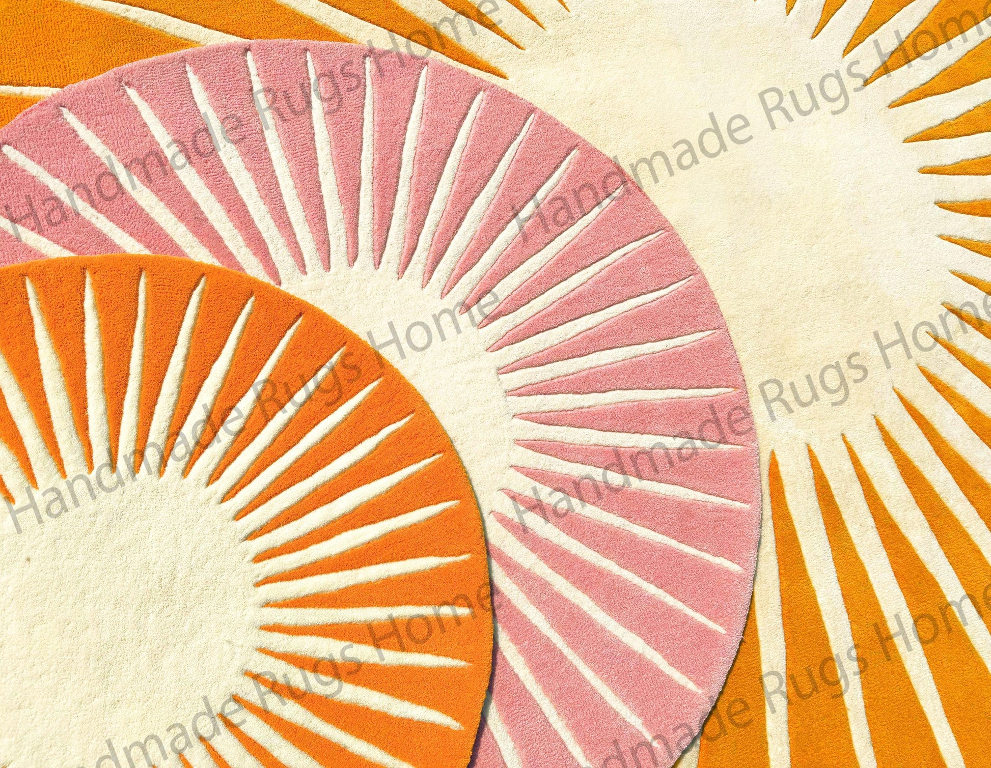 Artistic hand-tufted floor rug with a radiating sunburst design, placed near red seating with white quilted covers.