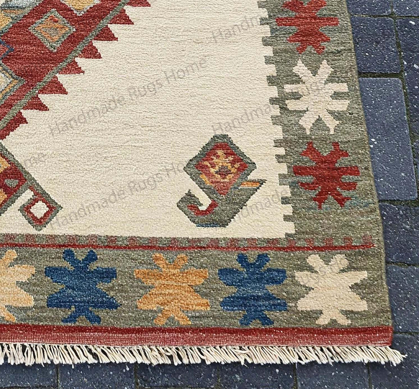 Vintage-inspired hand-knotted wool carpet with fringe