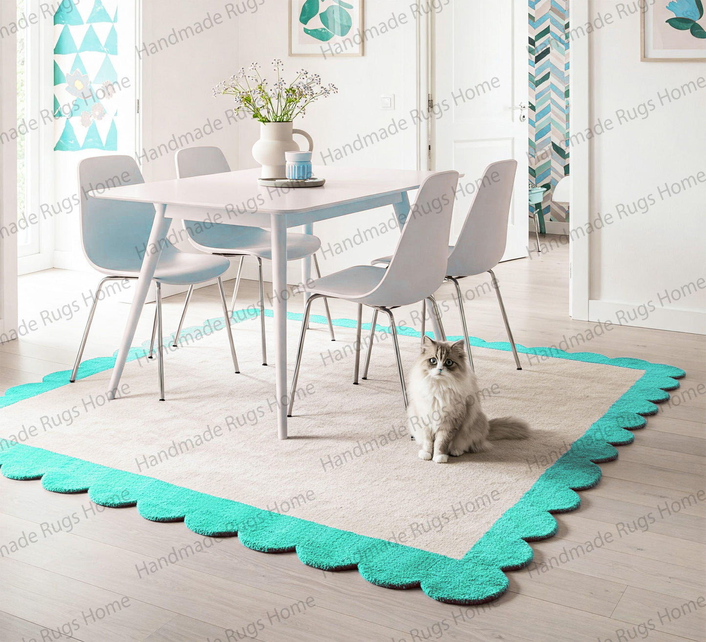 Hand-tufted wool rug with scalloped aqua border