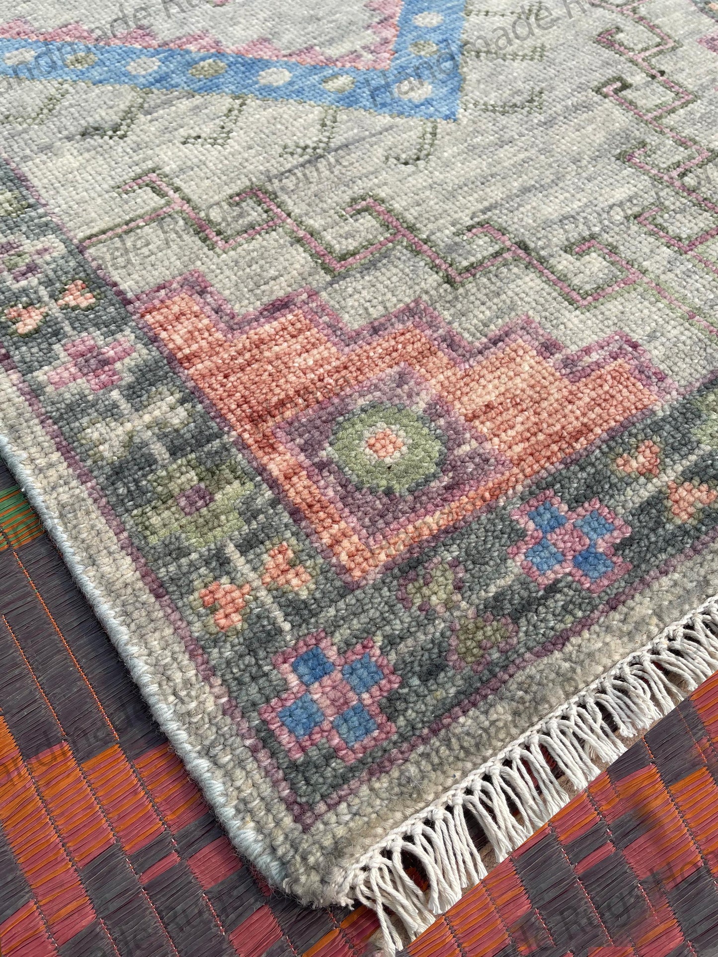 Unique pale grey, pink, and blue color wool entryway runner.