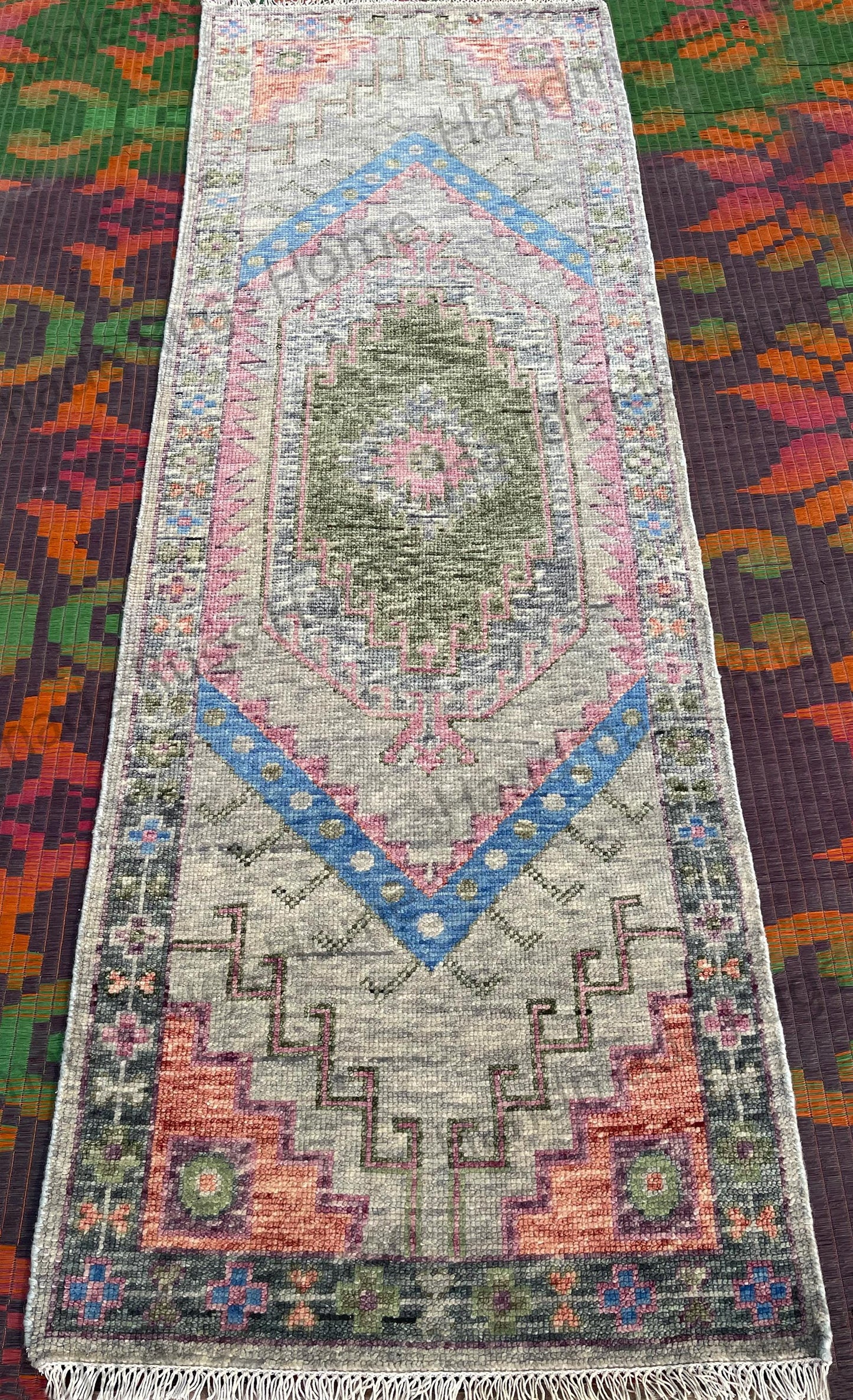 Pastel toned boho rug with fringe ends