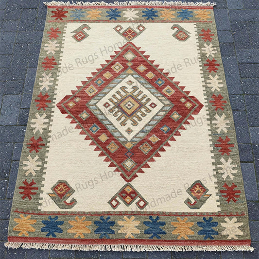 Handmade wool dhurrie rug with geometric tribal patterns
