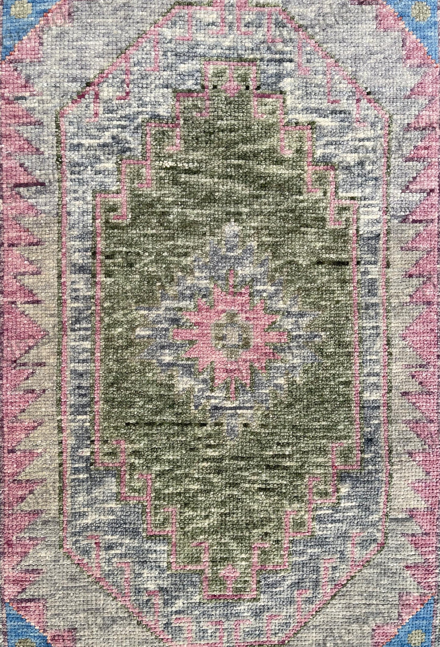 Hand-knotted wool rug with distressed look