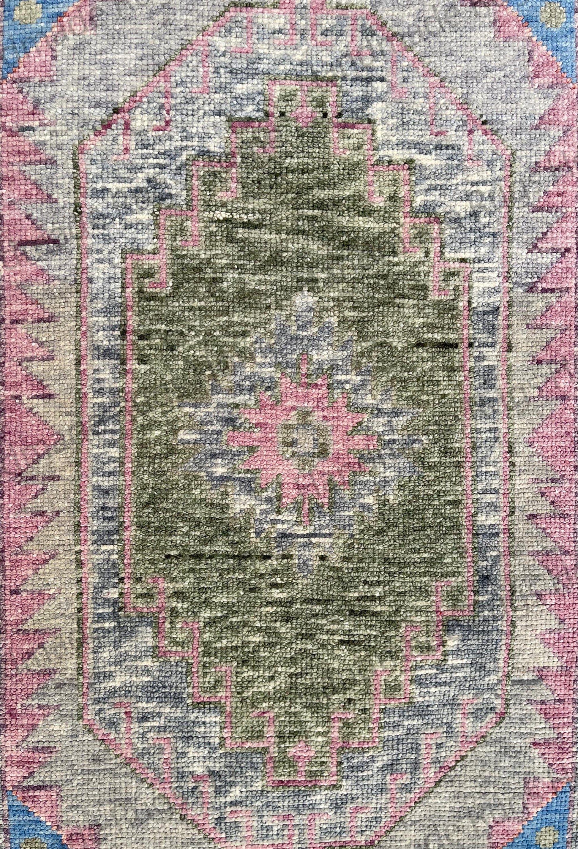 Hand-knotted wool rug with distressed look