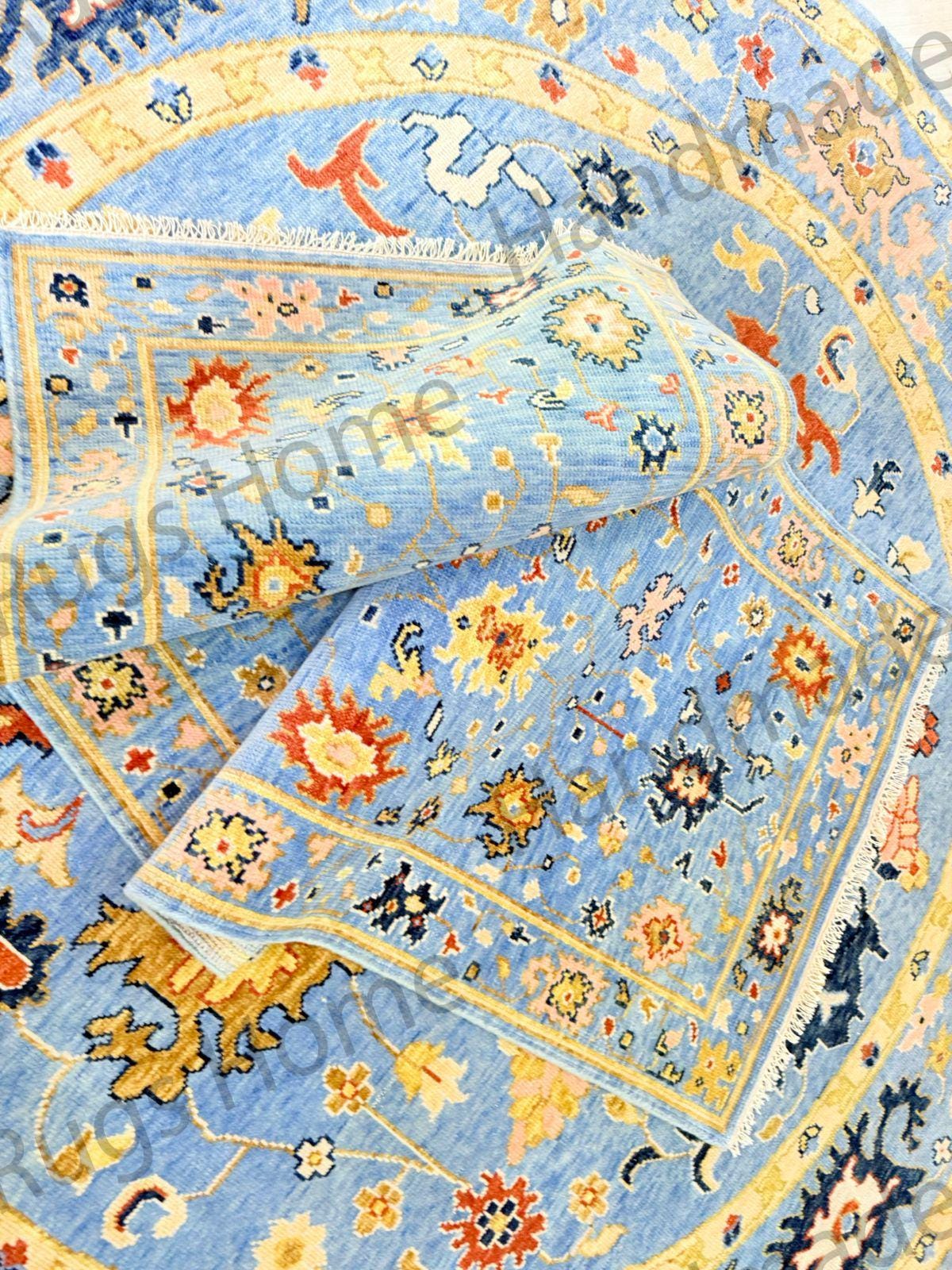 Hand-knotted blue oriental rug with floral patterns