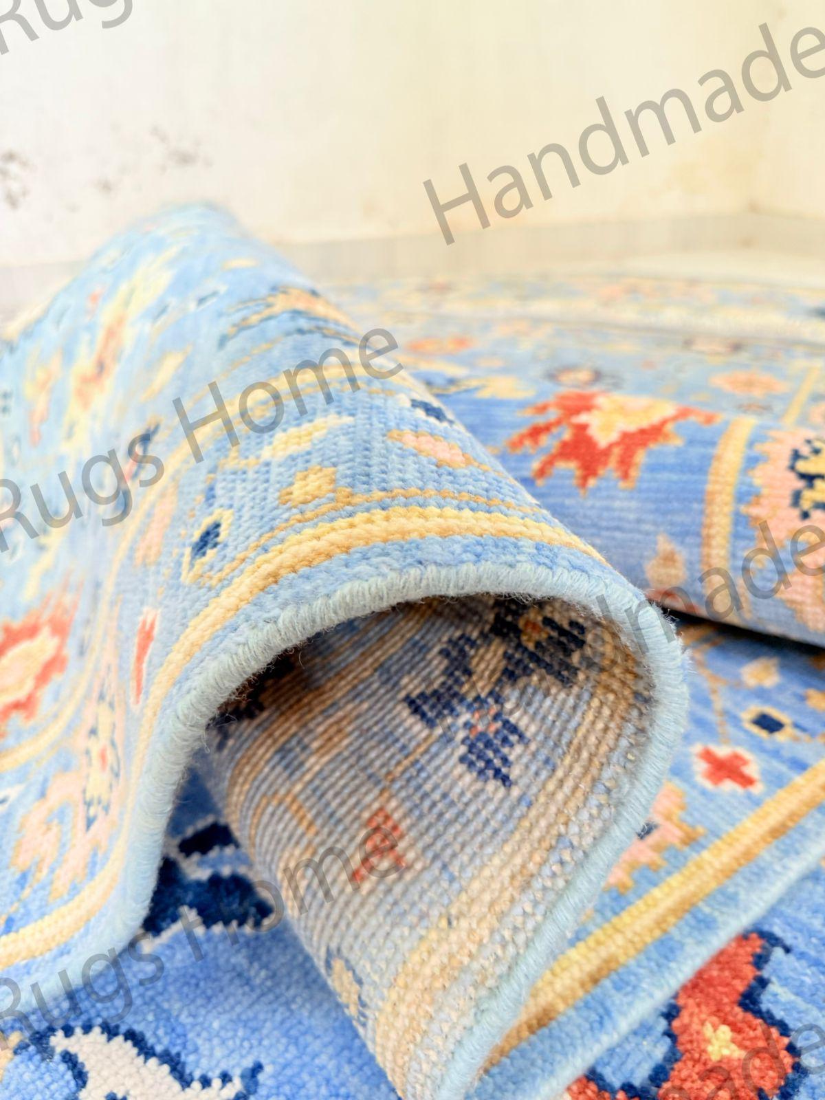 Luxury handmade rug with intricate border and central design