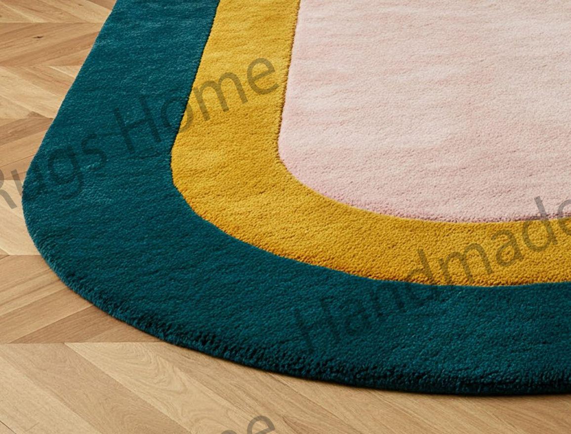 Golden retriever relaxing on a teal, mustard, and blush pink oval rug.