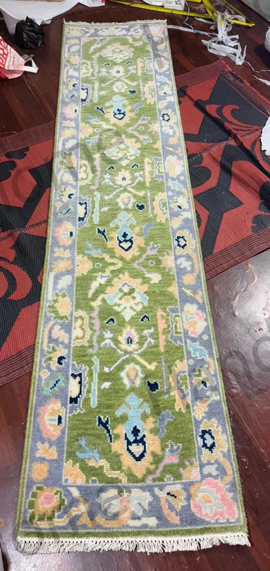 Handcrafted Oushak runner, intricate design.