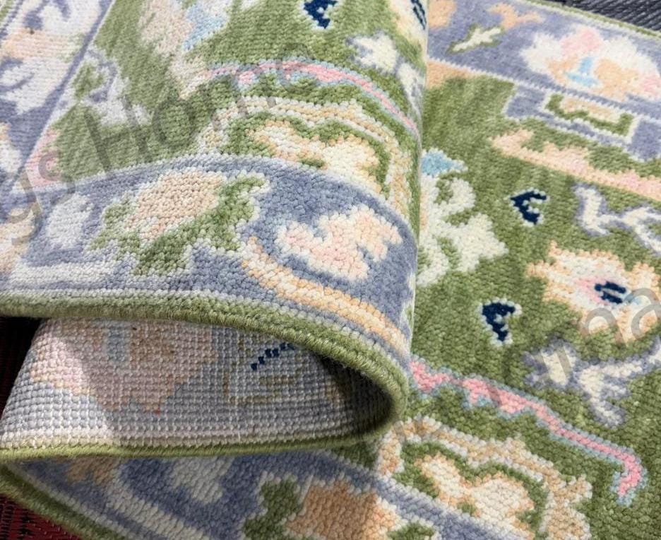 Oushak runner rug in green and lilac hues.
