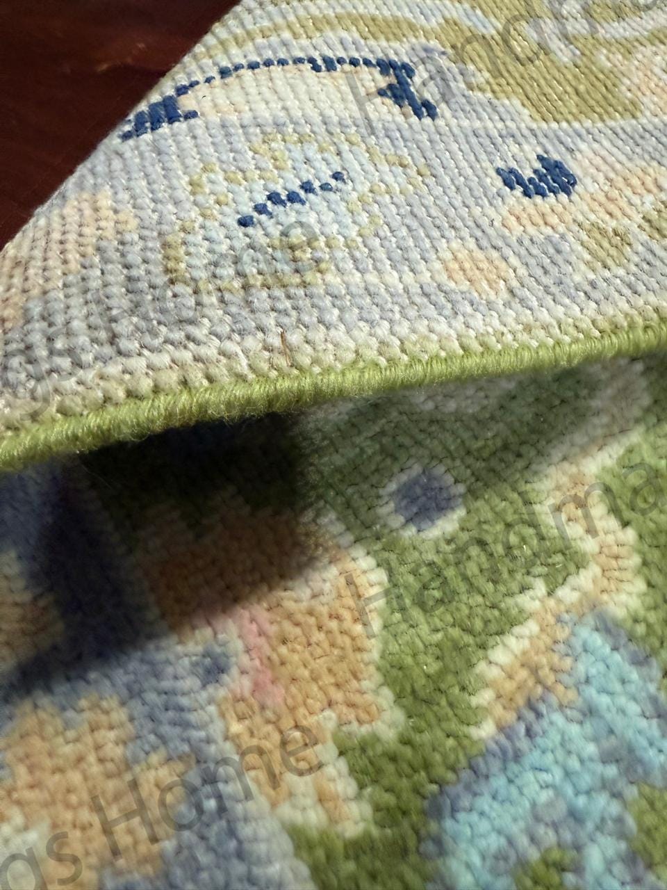 Elegant green and pastel Oushak rug.