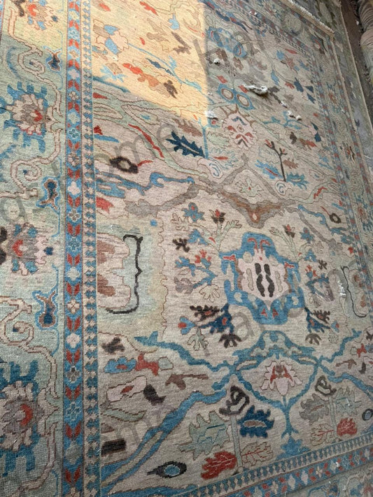 Muted Oushak rug: tranquil elegance, soft blues & grays.